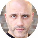 Mike Mousicos. Cockney. Male. Voiceover. Headshot. New.